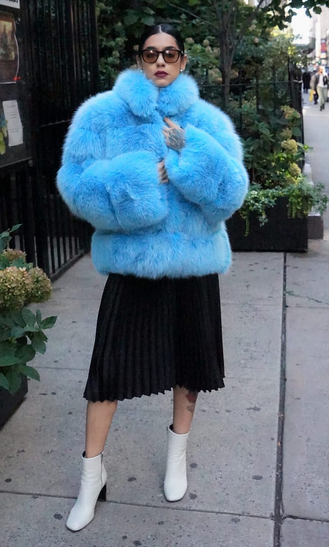 Woman Wearing a Sky Blue Fox Jacket